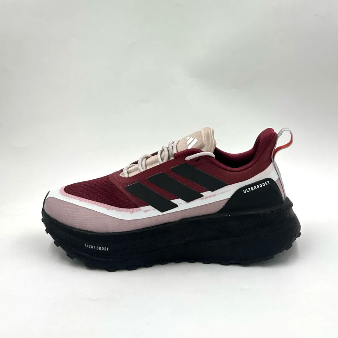 Adidas Ultraboost running shoes in a burgundy colorway